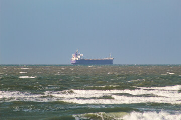 Ship on the horizon of S&atilde;o Marcos Bay in the north of the state of Maranh&atilde;o, northeast of Brazil.