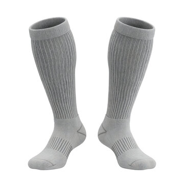 A pair of tall, light gray athletic compression socks with a ribbed leg texture and supportive knit on the foot, designed for sports and circulation on a transparent background.