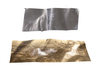 Set of crumpled metallic foil strips in silver and gold tones with reflective surface, wrinkles, and