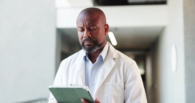 Doctor, tablet and thinking with black man in hospital for treatment plan, idea or medical report. Healthcare vision, digital results and checkup records with mature person for specialist referral