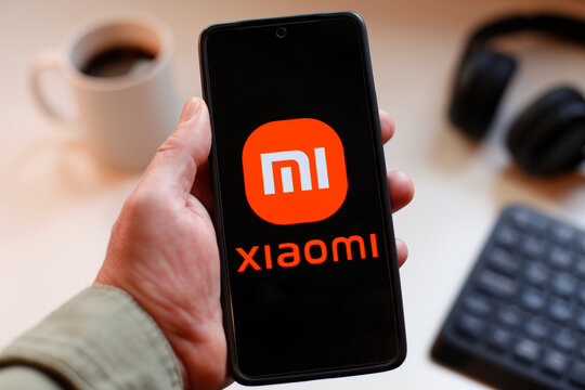 VALENCIA, SPAIN &ndash; 01-27, 2026: Hand Holding Smartphone With Xiaomi Logo On Screen, Modern Tech Brand Concept And Innovation