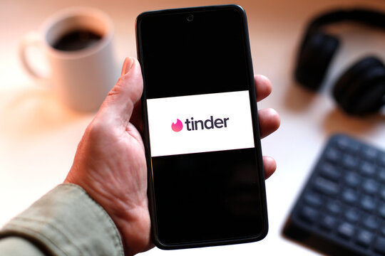 VALENCIA, SPAIN &ndash; 01-27, 2026: Holding Smartphone With Tinder Logo On Screen For Dating App Concept