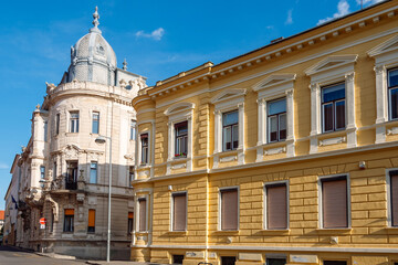 Obraz premium Habsburg-era architecture of Pécs, Hungary, showcasing the city's rich Austro-Hungarian heritage through its grand, colorful streetscapes.