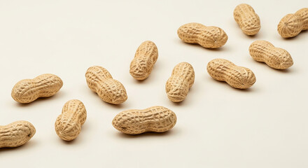 Natural Peanuts in Shells Scattered on Simple Light Background Healthy Protein Snack