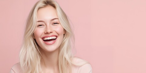 Naklejka premium Joyful young blonde woman laughing, close-up with perfect smile, pink background and ample right copyspace, concept for beauty advertising, dental hygiene and positive branding