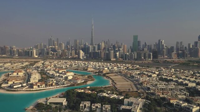 Aerial Panorama of Luxury Dubai Burj Khalifa Skyline and Residential Community with Turquoise Lagoons. 
