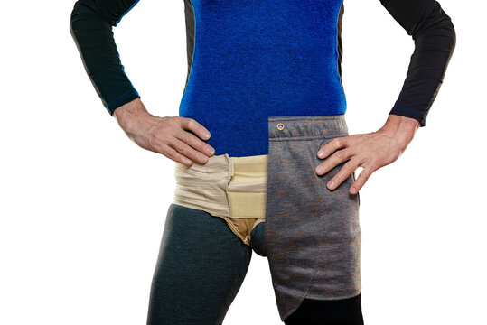 Closeup of man posing in inguinal hernia bandage before starting fitness training. Athletic male in partial attire with supportive wrap, post-workout recovery
