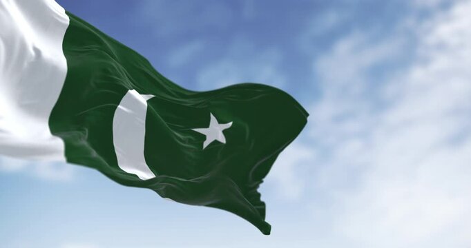 Close-up of Pakistan National flag waving on a clear day