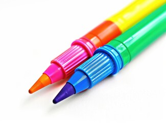Close-up of two vibrant felt-tip pens with colorful barrels and fine tips