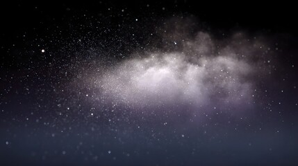 Obraz premium A luminous cloud of dust and stars scattered across the dark expanse of space