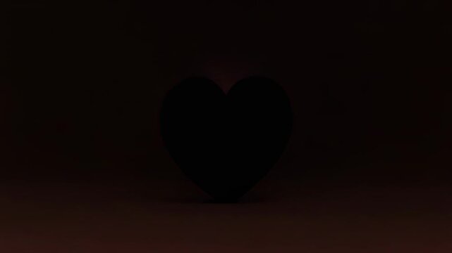 Spotlight rising, tufted heart cushion shifting pink to dark silhouette in studio, creating reveal