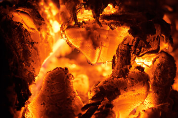 Close-up of smoldering wood after burning. Firewood burning in a rural stove.