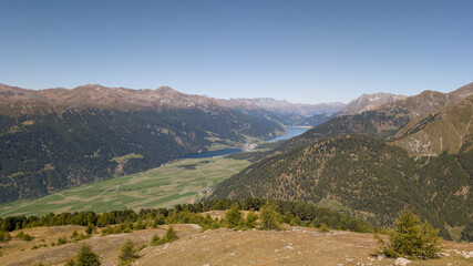 Fototapeta premium Aerial Panoramic View of Vinschgau Valley with Lake Reschen and Lake Haider