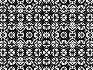This image features a seamless black and white geometric pattern with intricate circular designs.