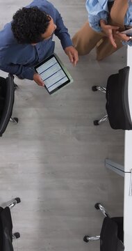 Above, tablet screen and walking with supervisor in office for agenda, planning or schedule. App, calendar and timetable with floor manager in workplace to monitor progress for task assignment