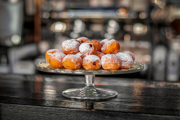 Many donuts on a glass tray