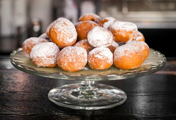 Many donuts on a glass tray