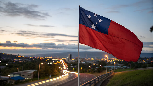 Close-up Samoa Flag Waving in the Wind. Evening background, In the capital of Apia, city lights and road