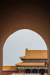 Obraz premium The Forbidden City,Traditional Chinese architecture viewed through an arched gateway