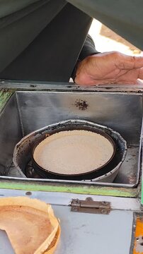 Food Vendor Making Indonesian Crepes (Kue Leker)