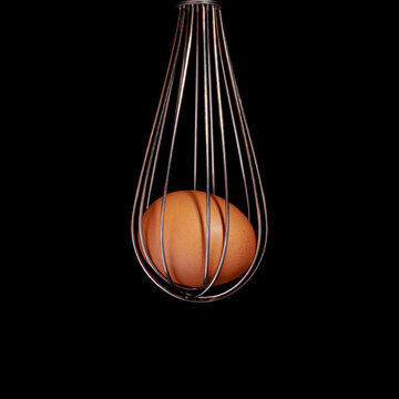 Un &oelig;uf et son fouet sur fond noir