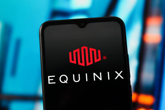 In this photo illustration, the Equinix logo is seen displayed on a smartphone screen.