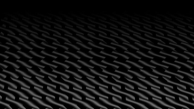 A video showcasing a close-up view of a black textured surface with a repeating pattern Abstrack background