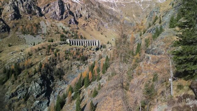 The Gleno Dam (Italy) is a historic ruin that collapsed in 1923, causing a tragic flood. Today, its impressive remains serve as a hiking destination and a powerful memorial to the disaster.