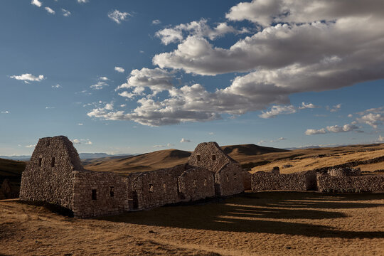 The stone masonry of Kanamarca stands as a testament to Inca architectural genius, set against the striking blue skies of Cusco.A window into the past, preserved in the high-altitude landscape of Peru