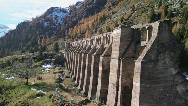 The Gleno Dam (Italy) is a historic ruin that collapsed in 1923, causing a tragic flood. Today, its impressive remains serve as a hiking destination and a powerful memorial to the disaster.