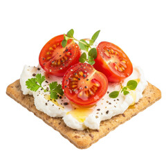 A close up of halved cherry tomatoes and herbs atop cream cheese on a cracker on transparent background