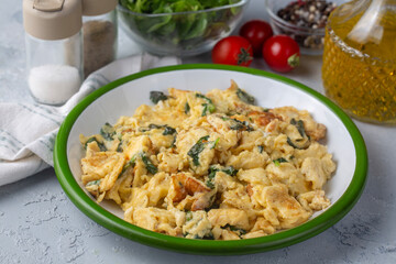 This delicious-looking vegetable omelet is prepared with eggs and various herbs.