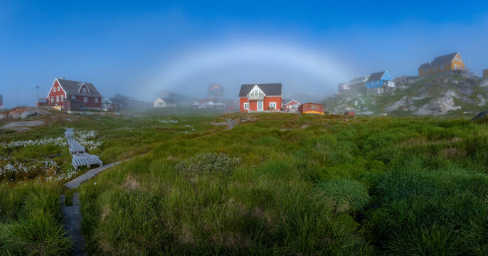Traditional Inuit houses in Greenland. Ililissat. White rainbow