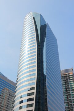 BANGKOK, THAILAND - DECEMBER 25, 2013: Sathorn Square building in Sathorn district of Bangkok. The building tenants are Embassy of Belgium, Beiersdorf, EssilorLuxottica, Roland Berger and Mizuho Bank.