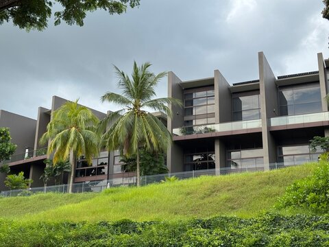 Luxury residential wing of The Club Residences by Capella Singapore with pool and lush tropical greenery, Sentosa Island, April 2025 