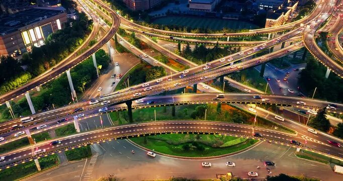 Aerial shot of a complex highway interchange with busy traffic at night in Nanjing.