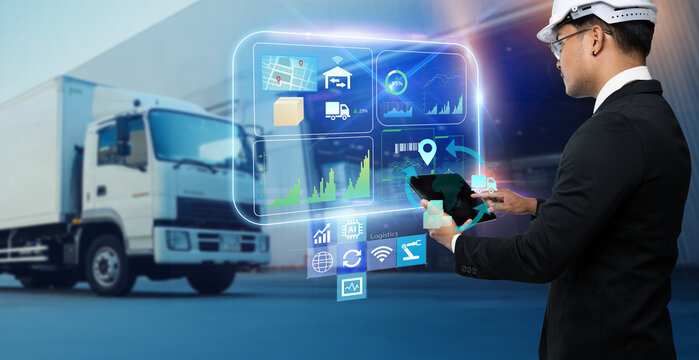 Business Logistics warehouse management system technology concept.Man hands using tablet on blurred warehouse as background
