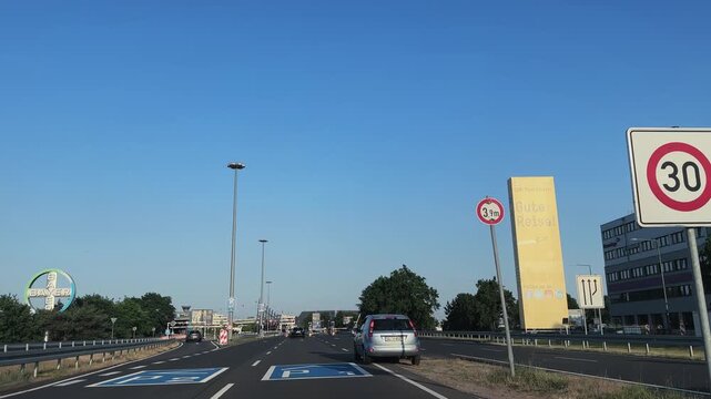 Car pov drive at approach to international airport in Cologne Bonn in Germany