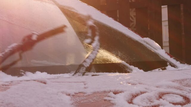 Windscreen wipers clear car windsheild from snow