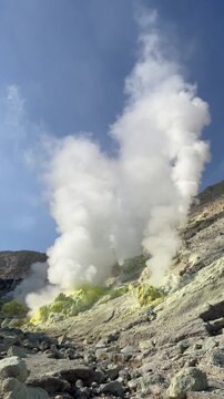 Steam rising from sulphurous fumarole vents on Mt. Atosanupuri volcano in Hokkaido, Japan