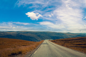 Driving a car on mountain road. Nature Norway.  Polar circle. The way to Nordkapp