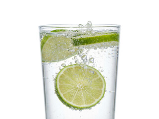 Refreshing lime soda with bubbles and vibrant slices floating in a clear glass.