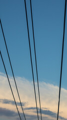 Power Lines Against Blue Sky