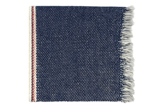 Blue indigo selvedge denim fabric swatch showing frayed edge and cotton texture, fashion textile material