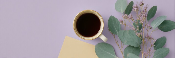 Cup of coffee is on a table next to a piece of paper