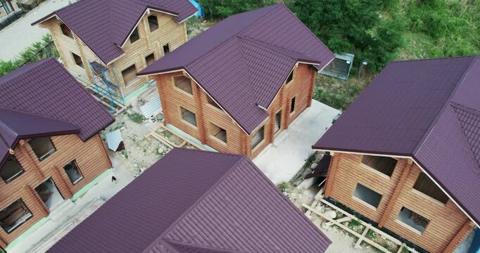 Construction industial site of houses built from wooden logs, aerial view