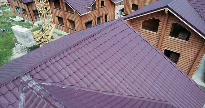 Wooden mountain house construction site, aerial view