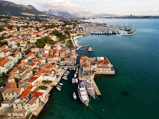 Obraz premium Aerial view of historic stone houses and ancient waterfront in Kastel Gomilica near Split, Croatia
