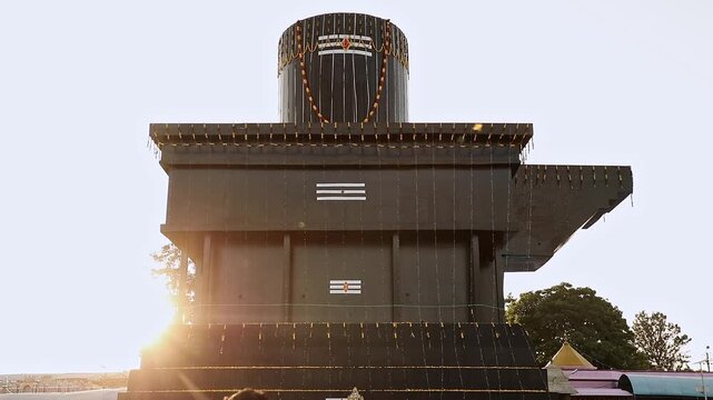 A panoramic revealing view of tallest shivalinga during morning sunrise at Kotilingeshwara Temple