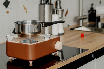 Portable camping gas stove used indoors during power outage